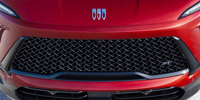 Top of red 2026 Buick Enclave featuring Buick logo