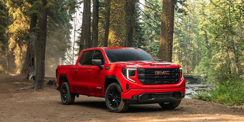Red 2026 GMC Sierra 1500 in woods near Poughkeepsie, NY