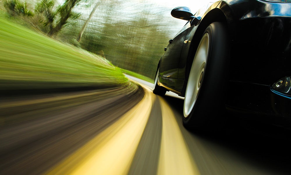 Motion shot of a car driving on the road - Hudson Buick GMC in Poughkeepsie, NY