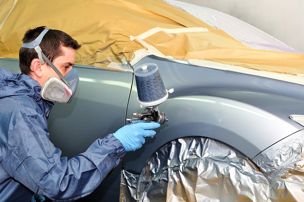 Service technician doing some body work on vehicle - Hudson Buick GMC in Poughkeepsie NY