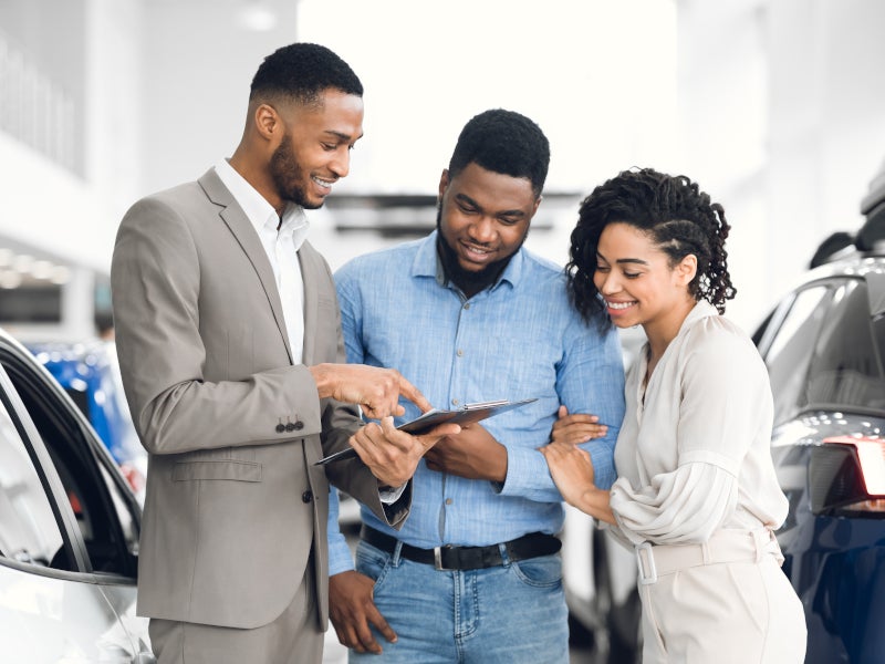 Customer couple speaking with sales representative - Hudson Buick GMC in Poughkeepsie, NY